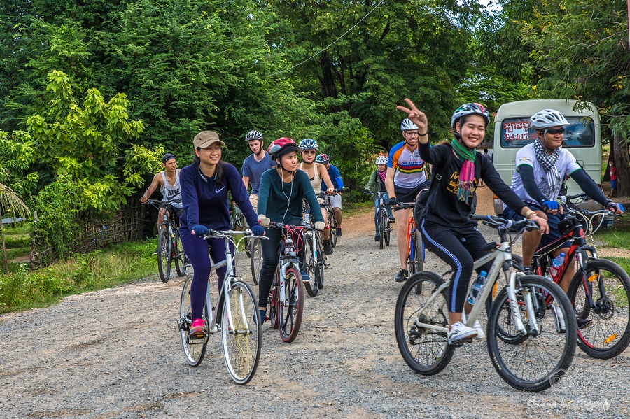 Cycling women group tour to explore the nature.